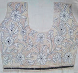 Close-up of floral Kantha hand embroidery on cotton blouse fabric
