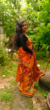 Close-up of lotus embroidery on Swarnalata mustard orange silk saree